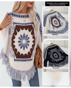 Detail of bohemian knit shawl featuring geometric patterns and fringe hem decorations