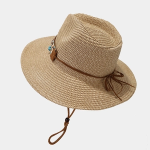 Bohemian wide-brim straw sun hat with turquoise bead detail and adjustable chin strap