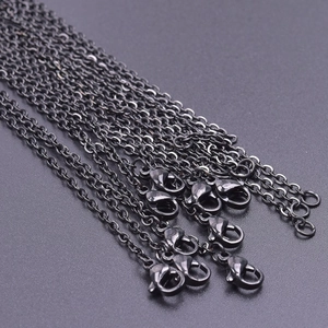 Close-up of 2mm black stainless steel cross chains with lobster clasps for jewelry making
