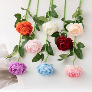 Detailed assortment of artificial peonies in multiple colors on a clean white background