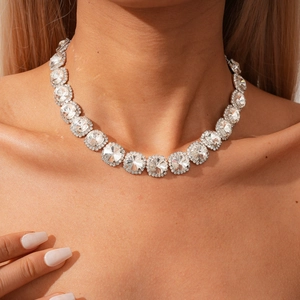 Macro view of crystal halo necklace with silver metal base and sparkling rhinestones