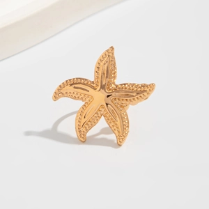 Golden metal starfish clip-on earring for women featuring realistic ocean vacation style