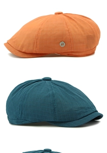 Detailed view of breathable mesh texture and metal badge on colorful newsboy caps