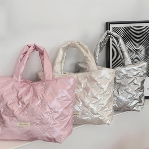 Bow quilted puffy tote bags in pink, beige and metallic silver with glossy finish