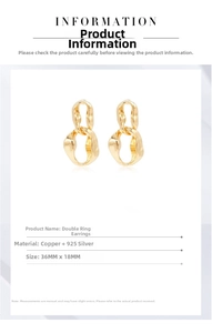 Detail view of interlocking gold double hoop earrings with 36mm by 18mm dimensions