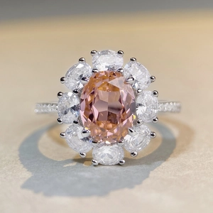 Sparkling S925 sterling silver flower halo ring with champagne oval stone and side diamonds