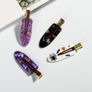 Halloween hair clip set with purple sequins, spider web and ghost patterns on white