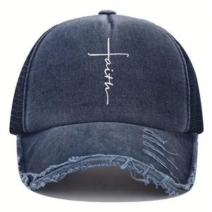 Detail of cross-shaped faith embroidery on navy washed denim baseball cap with mesh