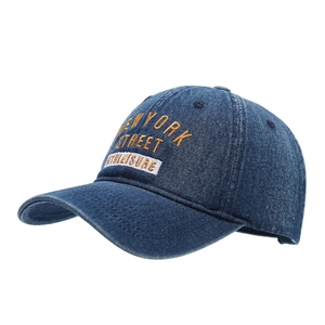 Dark blue denim baseball cap with New York street embroidery in a 45-degree angle view