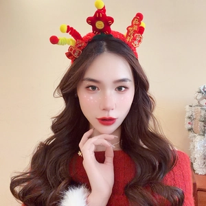 Detail of red festive headband with lucky tassels and pom-poms for Lunar New Year decor