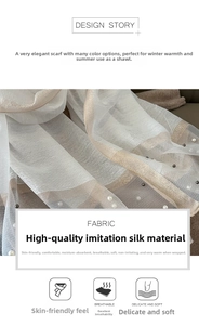 Detailed macro view of white silk-like scarf featuring elegant pearl beads and gold stripes