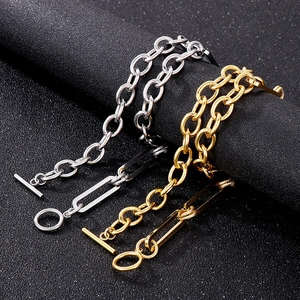 Detail of gold and silver stainless steel chunky chain bracelets with OT toggle clasps