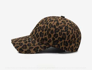 Side view of leopard print cotton baseball cap with distressed brim and six-panel design