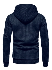 Detailed back view of dark blue hoodie showing textured waffle knit fabric and hood