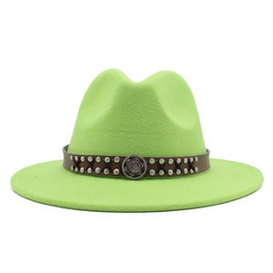 Detail of light green wool fedora hat featuring a brown studded faux leather band and emblem