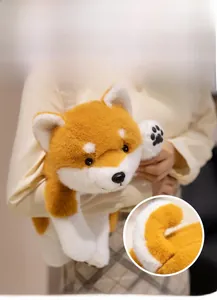 Close-up of plush Shiba Inu toy featuring soft texture and embroidered paw prints