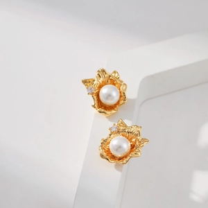 Irregular geometric floral gold stud earrings with white pearl and sparkling zircon