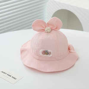 Close-up of pink baby sun hat showing delicate jacquard mesh texture and rabbit embroidery