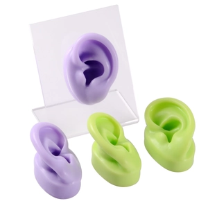 Silicone ear display models in purple and green with clear acrylic stands for jewelry