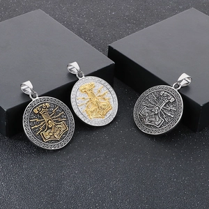 Three Viking Mjolnir pendants with Nordic runes in silver, gold, and black finishes