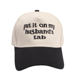 Two-tone baseball cap with 'put it on my husband's tab' embroidery on cotton fabric