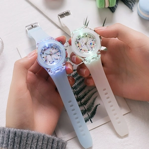 Close-up of LED glowing unicorn kids watches with soft translucent silicone straps