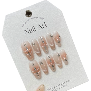 Handmade cat eye press-on nails with blush pink gradient, rhinestones and pearls
