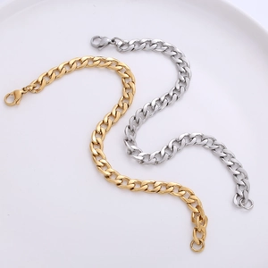 7mm stainless steel NK chain bracelets in gold and silver colors on a round tray