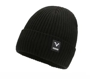 Close-up of black ribbed knit beanie featuring V SPORTS square patch and warm texture