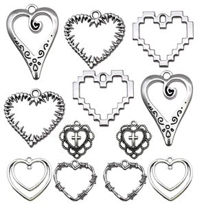 Assorted silver vintage hollow heart charms for DIY jewelry making and necklaces