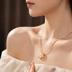 Elegant gold brushed pendant necklace with zircon crystals on a delicate snake chain