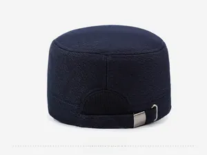 Detail of navy blue flat cap back with adjustable metal buckle and woven texture