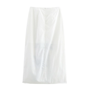 Detail of white A-line maxi skirt featuring delicate embroidery and smooth fabric drape