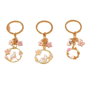 Charming enamel animal keychain set featuring bunnies and cats with pink cherry blossoms