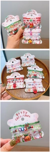 Detail of 4-piece colorful Christmas beaded bracelets with Santa and reindeer charms