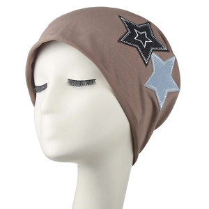 Brown knitted beanie with star patches and ear protection in American street style
