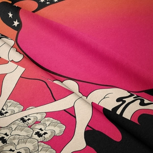 Close-up of soft bohemian tapestry fabric showing artistic floral and figure patterns