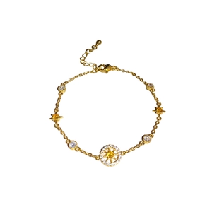 French star compass bracelet in gold finish with yellow and white zircon stones