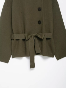 Detail of dark olive green knit cardigan with waist belt and black buttons texture