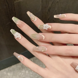 Handmade press-on nails with peach-lime cat-eye gradient and 3D floral accents