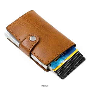 Detail view of the RFID aluminum card holder with brown leather and pop-up mechanism