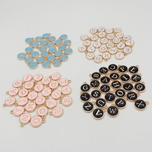 DIY round enamel alphabet charms in blue white pink and black with golden trim