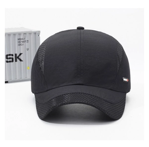 Detail of breathable mesh panel and diamond textured brim on black quick-dry sport cap