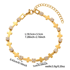 Detail view of gold cross bracelet with zircon stones and technical size specifications