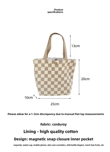Detail view of corduroy tote bag showing beige checkerboard pattern and magnetic closure