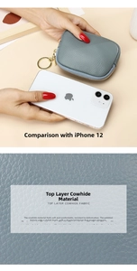 Detail of grey lychee pattern leather mini wallet next to a phone for size comparison