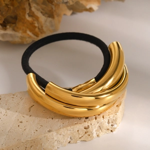Minimalist gold metal tube hair tie on natural stone base for high ponytail styling
