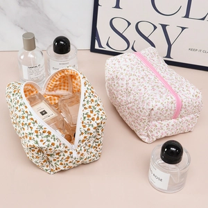Quilted cotton floral makeup bag showing large capacity and zipper storage details