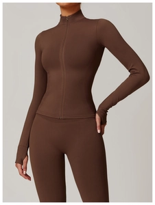 Detail of coffee brown yoga jacket featuring stand collar and thumbhole sleeves