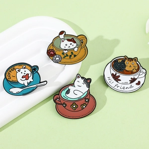 Detailed view of four colorful cat coffee cup enamel pins made of zinc alloy
